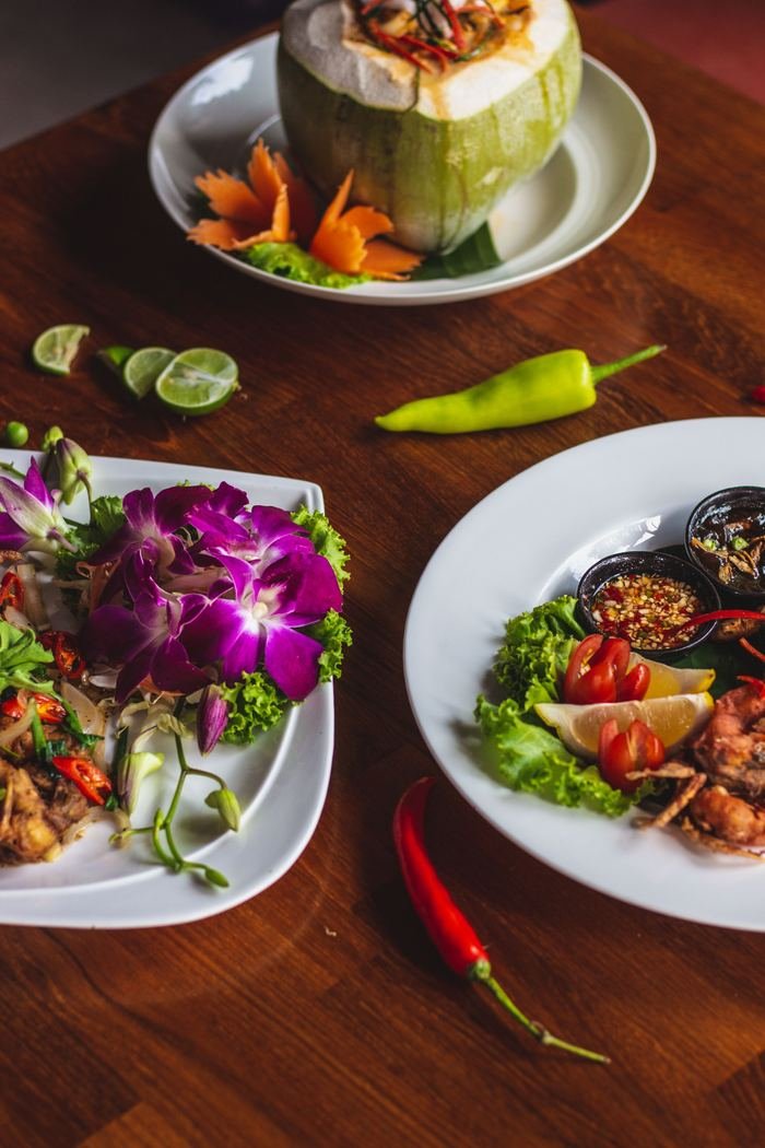 Thai salad plates with orchid garnish
